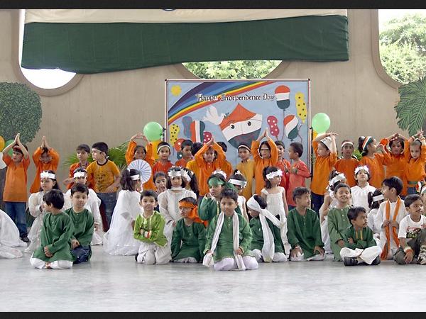 Children perform dance in tri-colour